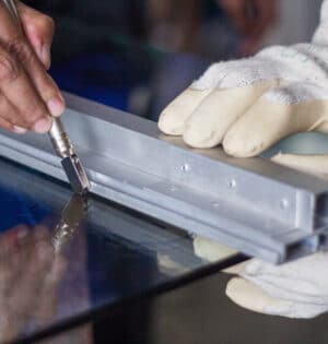 Technicians are using cutting tools, cut glass according to customer size