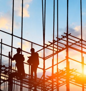 construction worker on construction site at sunset