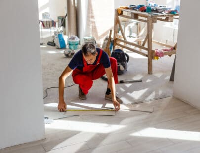 Installing ceramic floor tiles - measuring and cutting the pieces, closeup