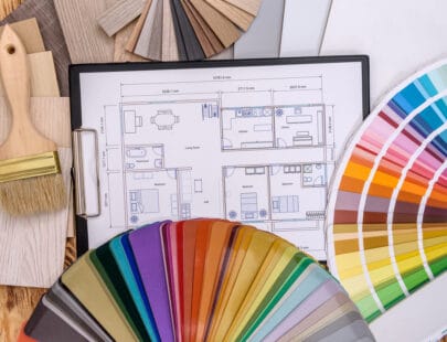 House project with different design tools on table
